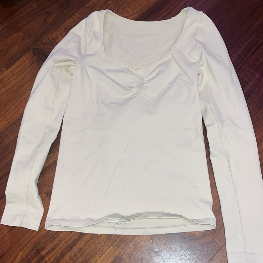 Cream tight long-sleeve shirt